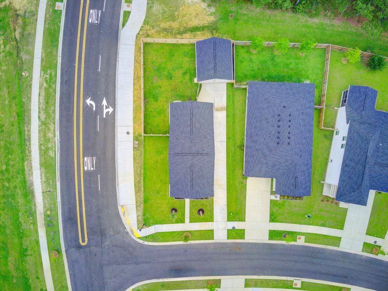 Front exterior of a new home in Limehouse Village: Row Collection, Summerville, SC, highlighting curb appeal (Image 27).