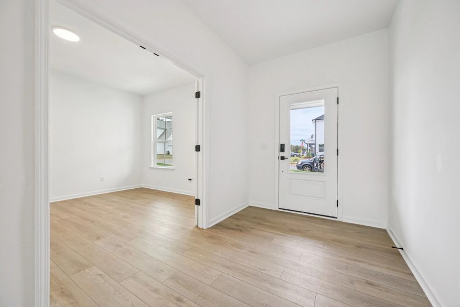 Foyer featuring the AW Collection® Serene - Soft light and open space create a calm welcome.