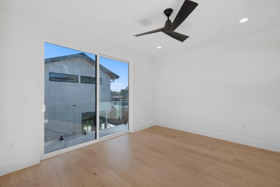 Spare room featuring wood finished floors, recessed lighting, and ceiling fan Spare room featuring wood finished floors, recessed lighting, and ceiling fan
