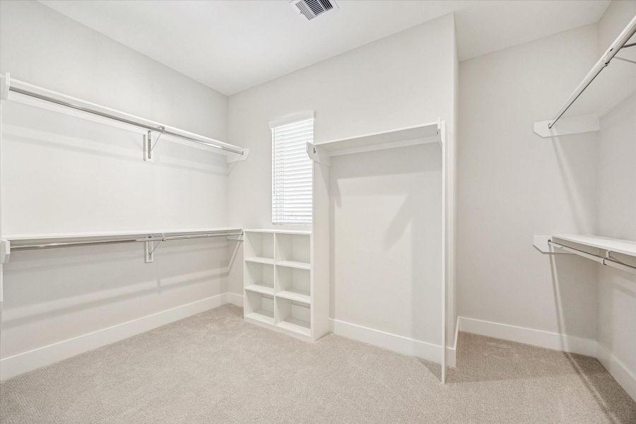 Large primary closet with built-ins.