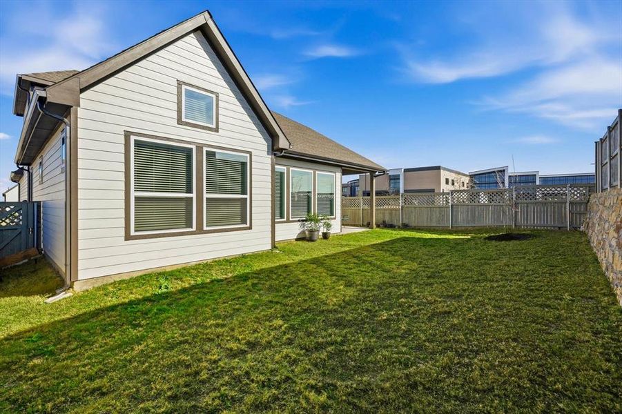 Exterior details and patio area of a home in Pecan Square - Gardens, Northlake (Image 25). Exterior details and patio area of a home in Pecan Square - Gardens, Northlake (Image 25).