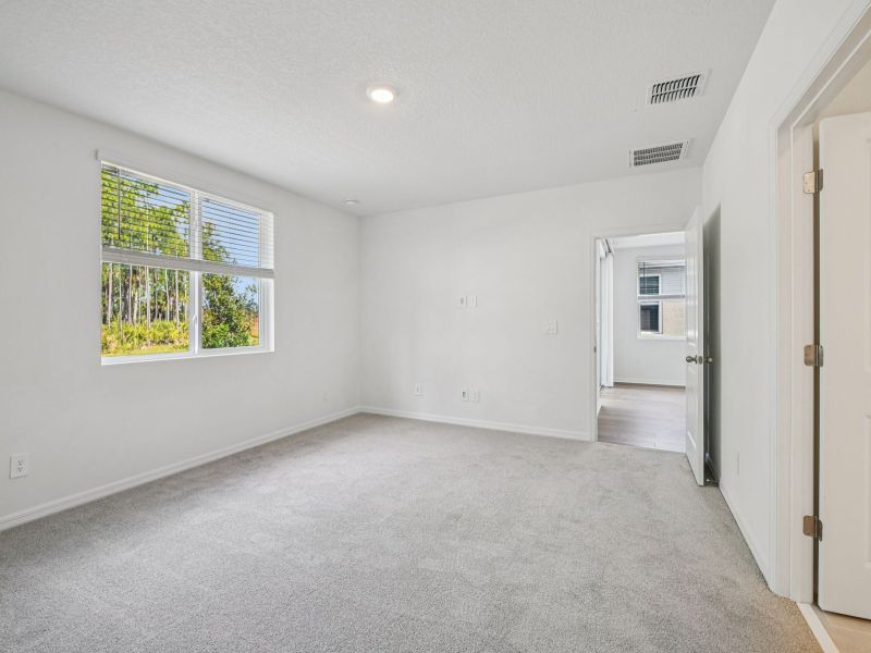 Spacious, unfurnished interior of a new home in Ridgehaven - Villas, Ormond Beach (Image 15).