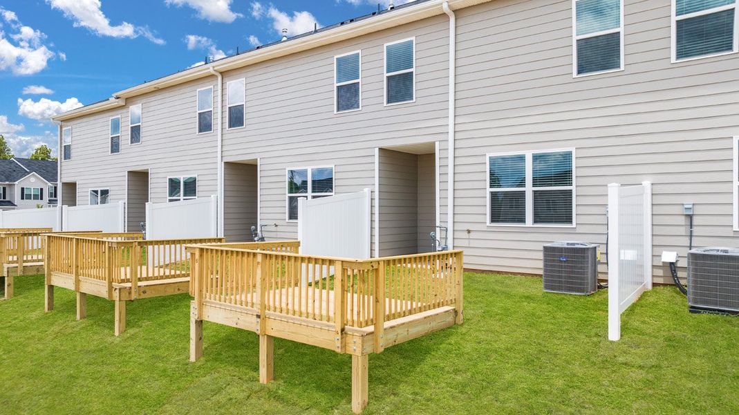 Front exterior of a new home in The Parish at Flat Rock Townhomes, Graniteville, SC, highlighting curb appeal (Image 20). Front exterior of a new home in The Parish at Flat Rock Townhomes, Graniteville, SC, highlighting curb appeal (Image 20).