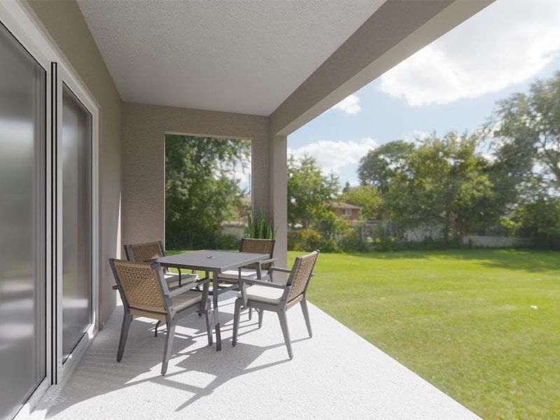 Your living space opens to a private covered lanai, providing desirable outdoor living space - Daisy townhome by Highland Homes  (Artist`s rendering)