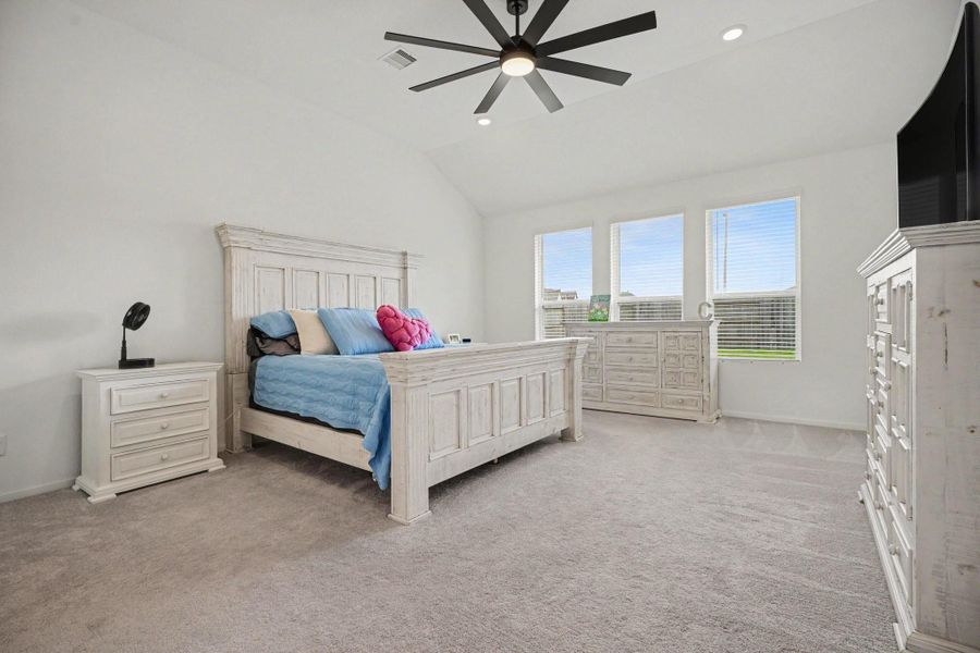 Spacious primary suite featuring high ceilings, generous proportions, and large windows that fill the room with natural light. Spacious primary suite featuring high ceilings, generous proportions, and large windows that fill the room with natural light.