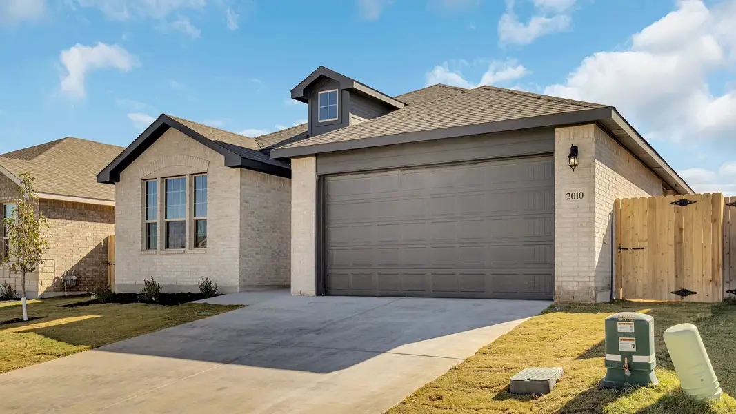 Front exterior of a new home in Northwest Passage, Midland, TX, highlighting curb appeal (Image 2). Front exterior of a new home in Northwest Passage, Midland, TX, highlighting curb appeal (Image 2).