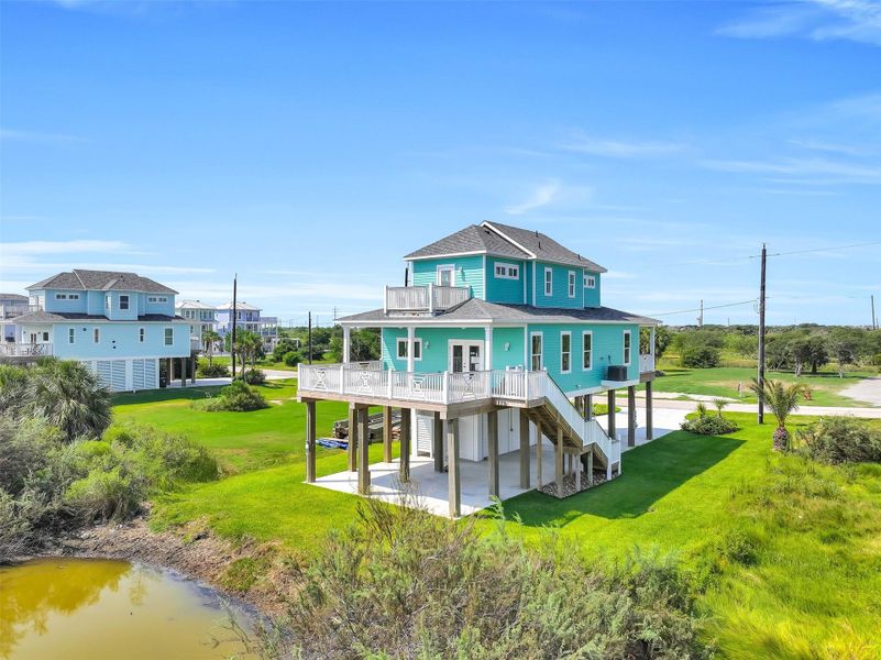 Front exterior of a new home in , Galveston, TX, highlighting curb appeal (Image 20).