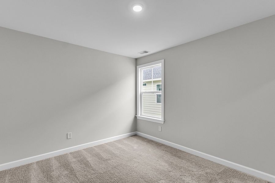 Spacious, unfurnished interior of a new home in Pineland Preserve, Summerville (Image 39).