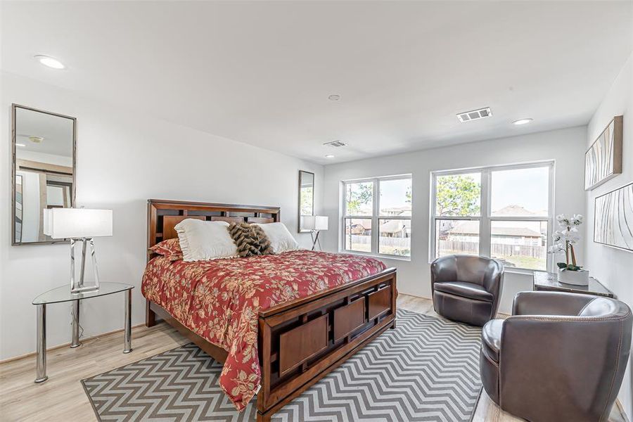 Primary Bedroom is large in size with an abundance of natural light