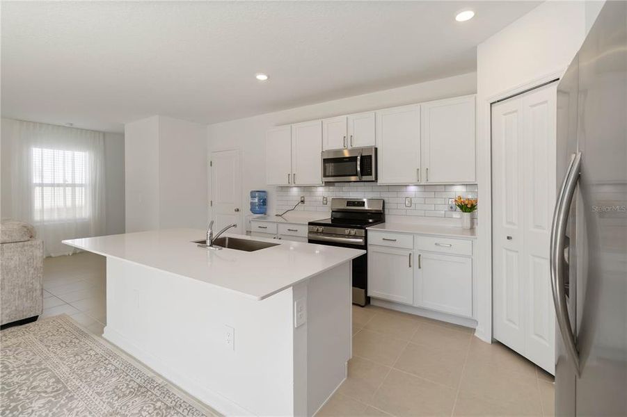 Furnished interior view inside a new home in Peace Creek Reserve: Manor Key Collection, Winter Haven (Image 13).