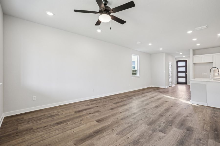 A kitchen with a wood floor.
