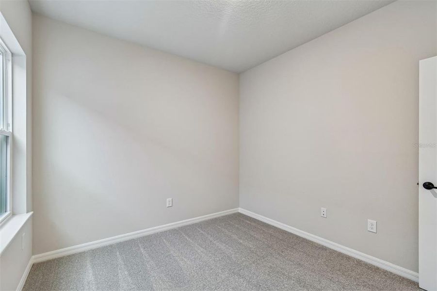 Spacious, unfurnished interior of a new home in Laureate Park at Lake Nona - Garden Series, Orlando (Image 24).