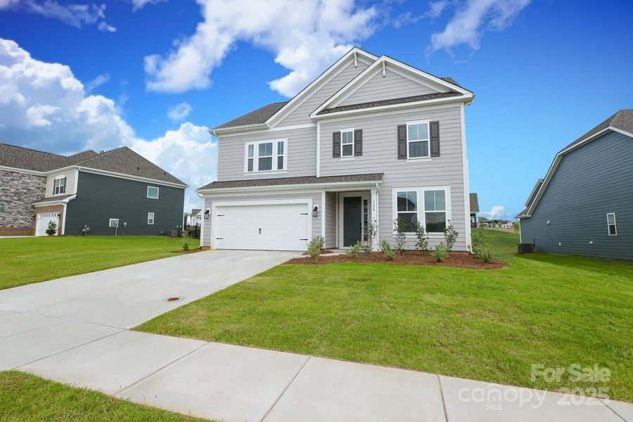Front exterior of a new home in Estates at Sugar Creek, Indian Land, SC, highlighting curb appeal (Image 22).