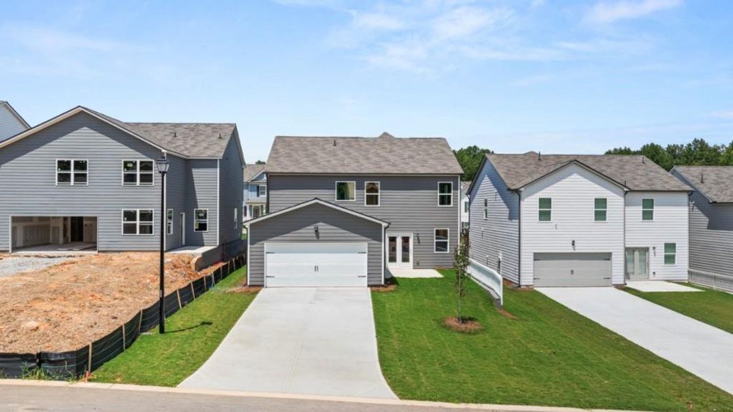 Front exterior of a new home in Braselton Village, Braselton, GA, highlighting curb appeal (Image 2). Front exterior of a new home in Braselton Village, Braselton, GA, highlighting curb appeal (Image 2).