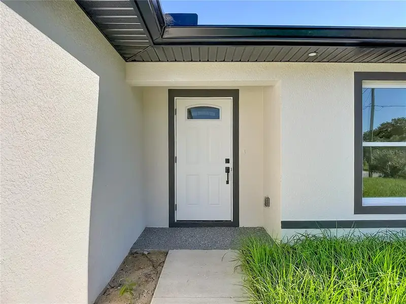 Exterior details and patio area of a home in , Lehigh Acres (Image 25). Exterior details and patio area of a home in , Lehigh Acres (Image 25).