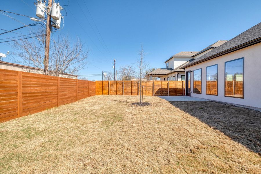 View of yard with a fenced backyard