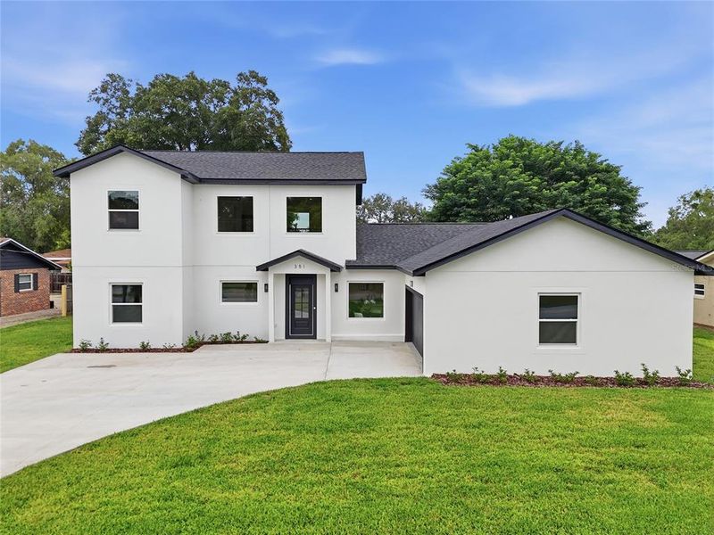 Front exterior of a new home in , Longwood, FL, highlighting curb appeal (Image 2). Front exterior of a new home in , Longwood, FL, highlighting curb appeal (Image 2).