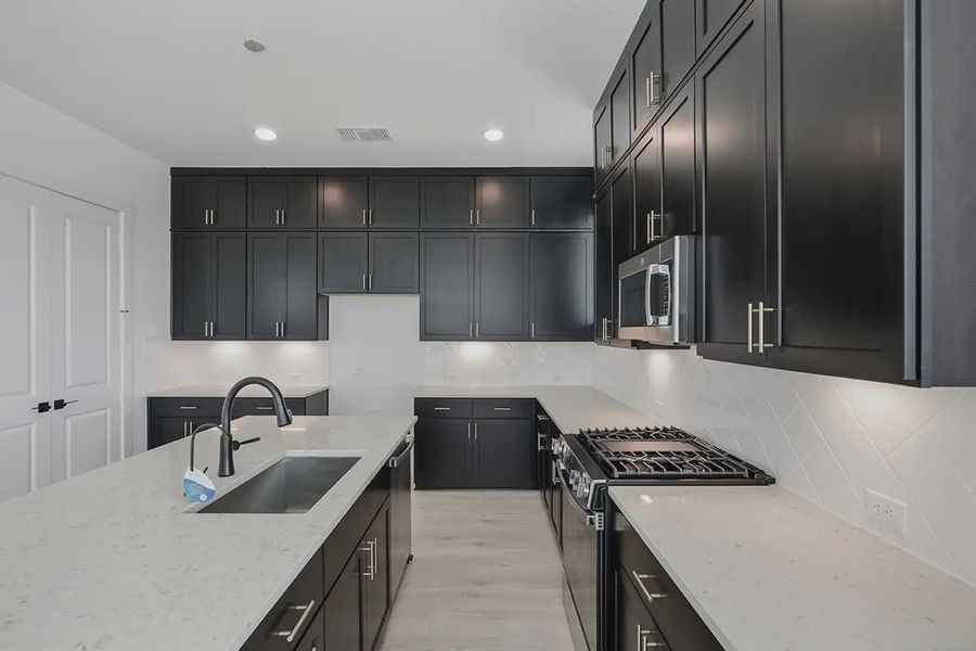 Representative furnished interior of a home built from the Athena by Chesmar Homes in Prominence Urban, San Antonio (Image 10).