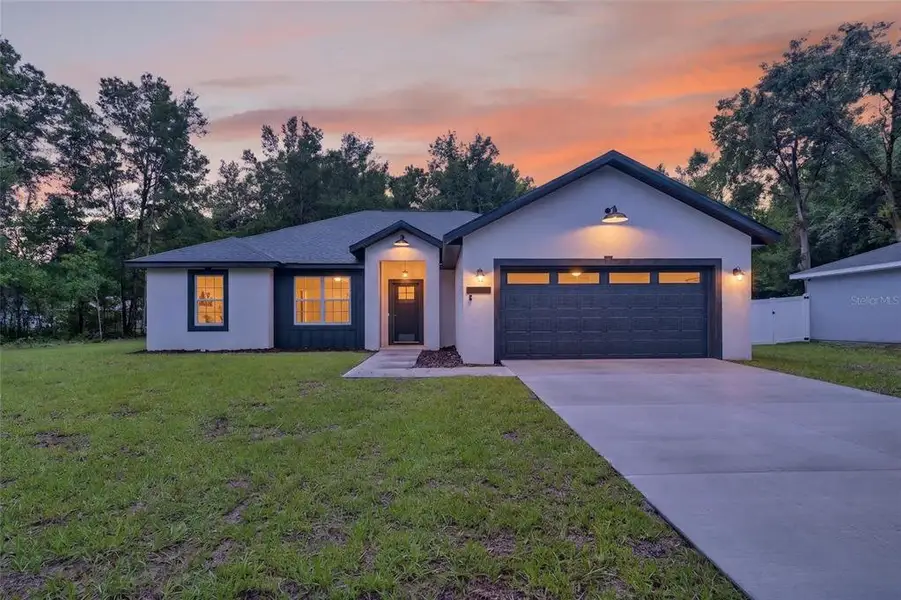 Front exterior of a new home in , Ocala, FL, highlighting curb appeal (Image 20).