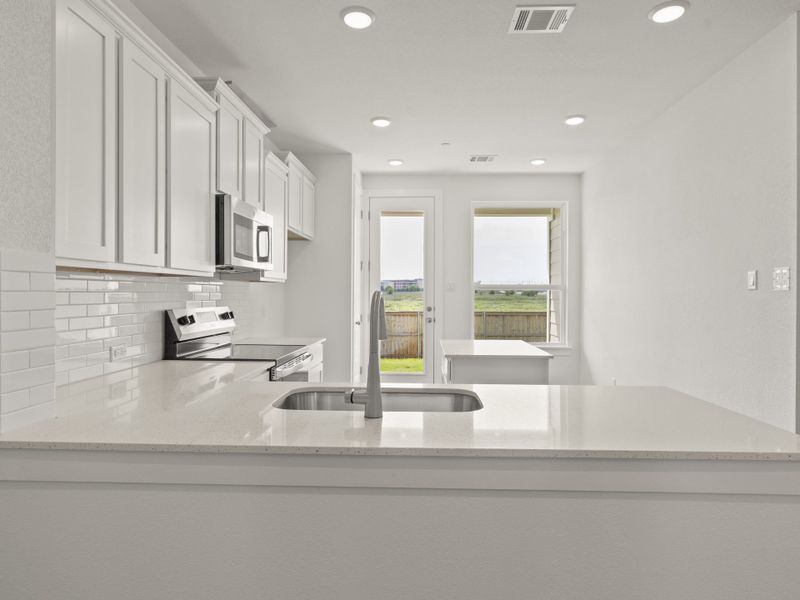 Furnished interior view inside a new home in Avery Centre, Round Rock (Image 6).