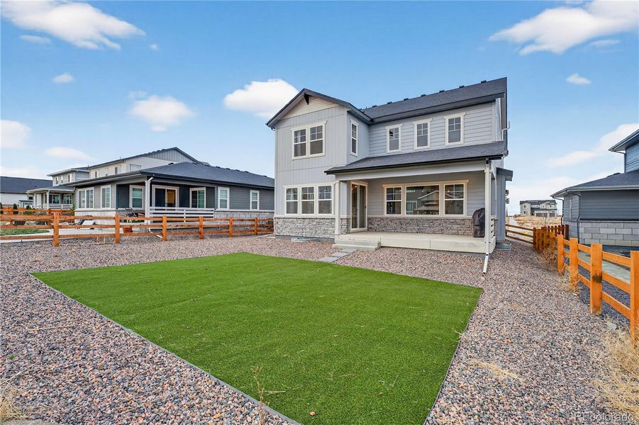 Exterior details and patio area of a home in Prelude at The Aurora Highlands, Aurora (Image 26).