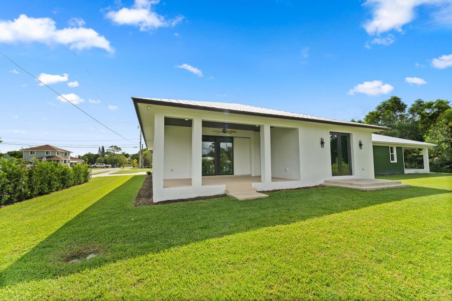Front exterior of a new home in , Stuart, FL, highlighting curb appeal (Image 21).