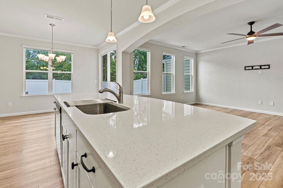 This expansive upgraded, quartz island is the heart of the kitchen—ideal for prepping meals, hosting friends, or simply gathering with family for everyday moments. This expansive upgraded, quartz island is the heart of the kitchen—ideal for prepping meals, hosting friends, or simply gathering with family for everyday moments.