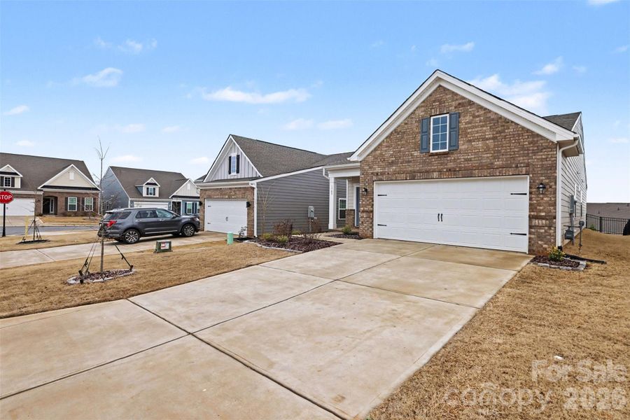 Front exterior of a new home in Elizabeth, Fort Mill, SC, highlighting curb appeal (Image 23). Front exterior of a new home in Elizabeth, Fort Mill, SC, highlighting curb appeal (Image 23).
