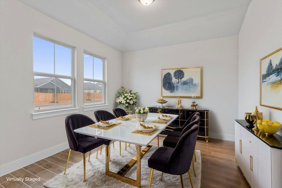 Naturally illuminated by dual windows, this elegant dining room offers a refined space for entertaining.