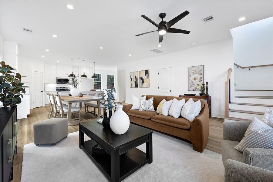 Seamless flow between kitchen, dining, and living room.
