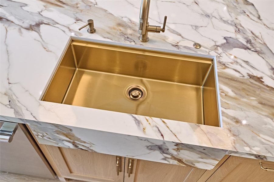 Gold colored stainless steel sink is both stain and fingerprint resistant - beauty & brawn.