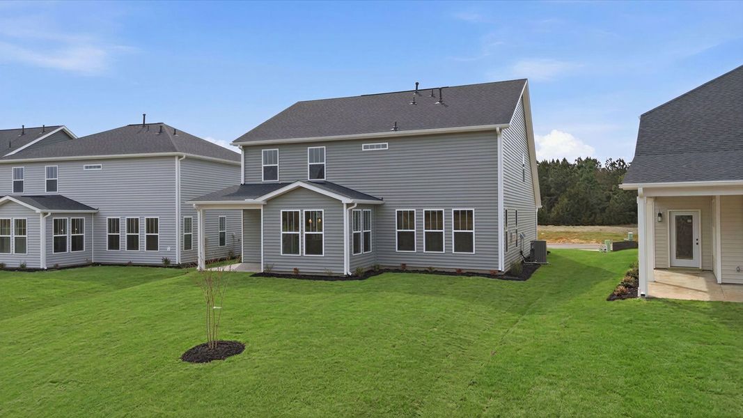 Superior curb appeal continues to the back with a refined, covered outdoor living space and large backyard at Foxbank