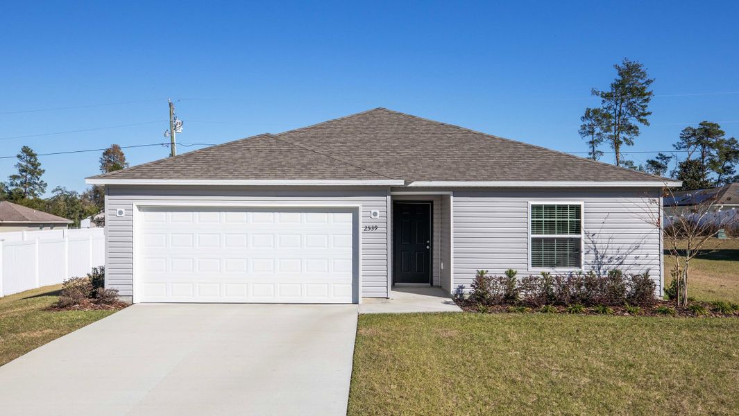 Representative exterior photo of a completed home built from the Violet by Maronda Homes in Coastal Communities, Edgewater, FL (Image 2). Representative exterior photo of a completed home built from the Violet by Maronda Homes in Coastal Communities, Edgewater, FL (Image 2).