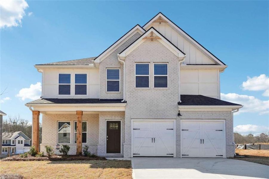 Front exterior of a new home in Conner Springs, Social Circle, GA, highlighting curb appeal (Image 1).