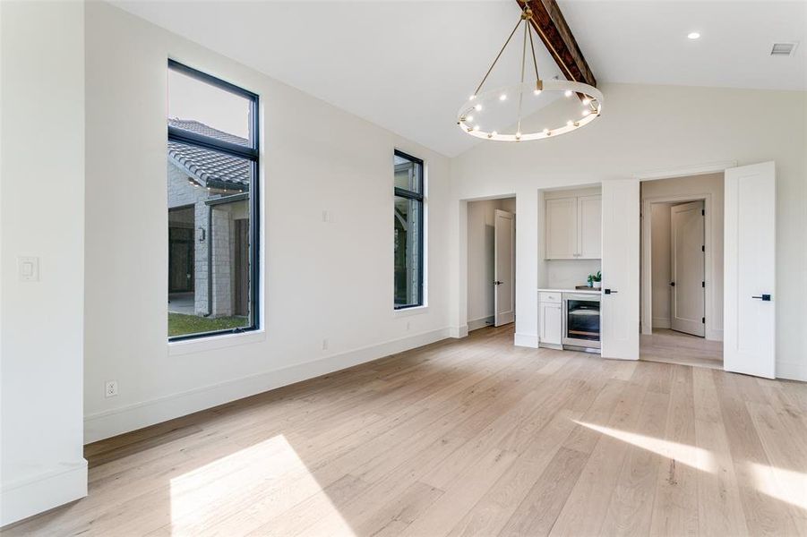 Spacious primary bedroom offers a sitting area and a wine/coffee bar. Spacious primary bedroom offers a sitting area and a wine/coffee bar.