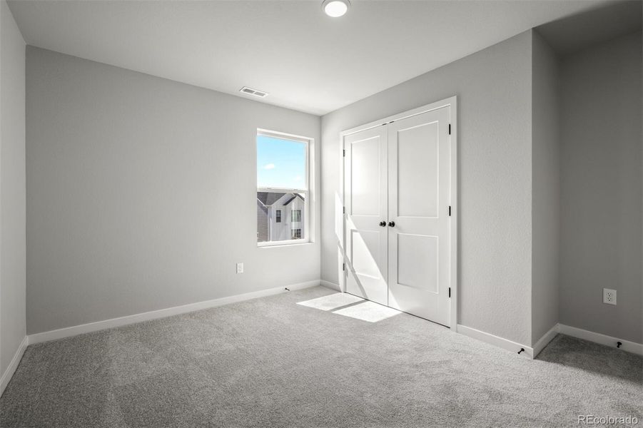 Spacious, unfurnished interior of a new home in Revel Crossing at Wolf Ranch – The Ascent Collection, Colorado Springs (Image 25).