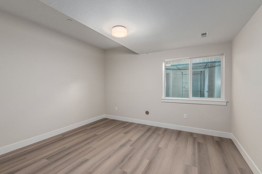 Representative unfurnished interior of a home built from the Luxe by Scott Felder Homes in Westerly, Erie (Image 43).