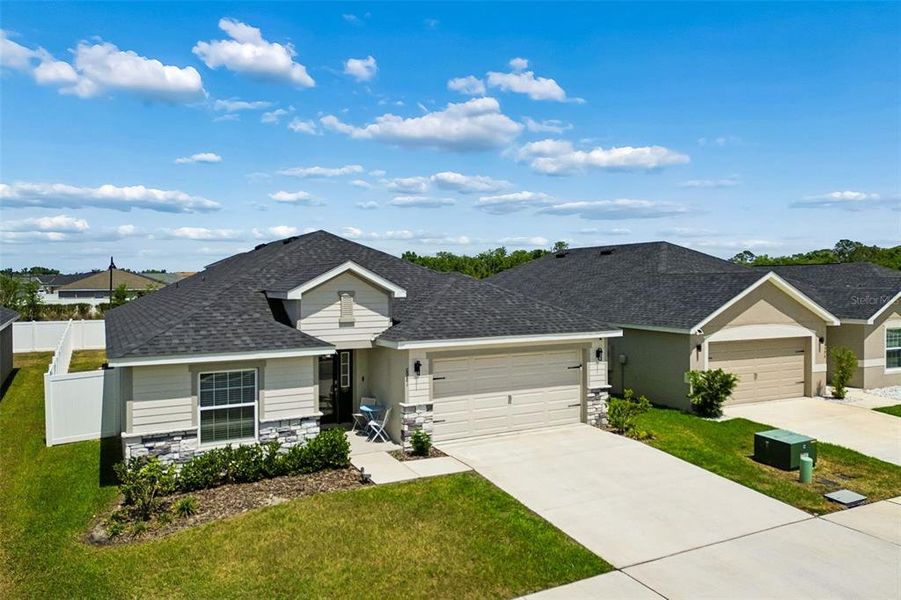 Front exterior of a new home in , Zephyrhills, FL, highlighting curb appeal (Image 26).