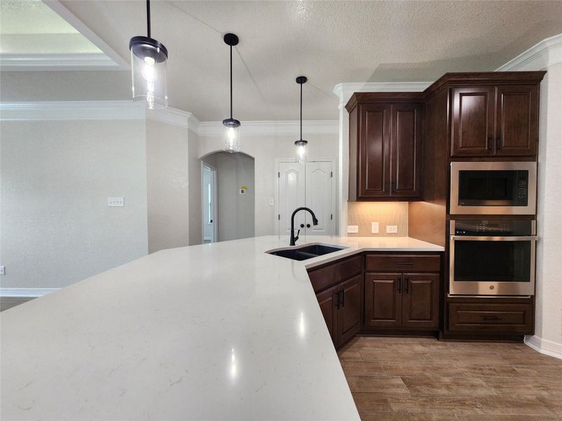 Culinary delights await in this modern kitchen with ample counter space and state-of-the-art appliances. Culinary delights await in this modern kitchen with ample counter space and state-of-the-art appliances.