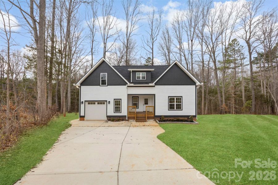 Front exterior of a new home in , China Grove, NC, highlighting curb appeal (Image 1). Front exterior of a new home in , China Grove, NC, highlighting curb appeal (Image 1).