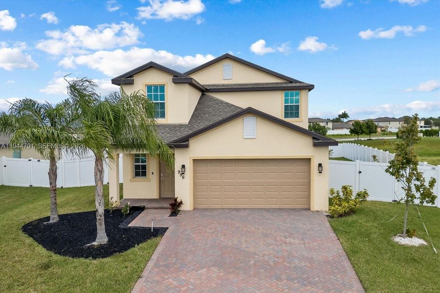 Front exterior of a new home in , Fort Pierce, FL, highlighting curb appeal (Image 20).