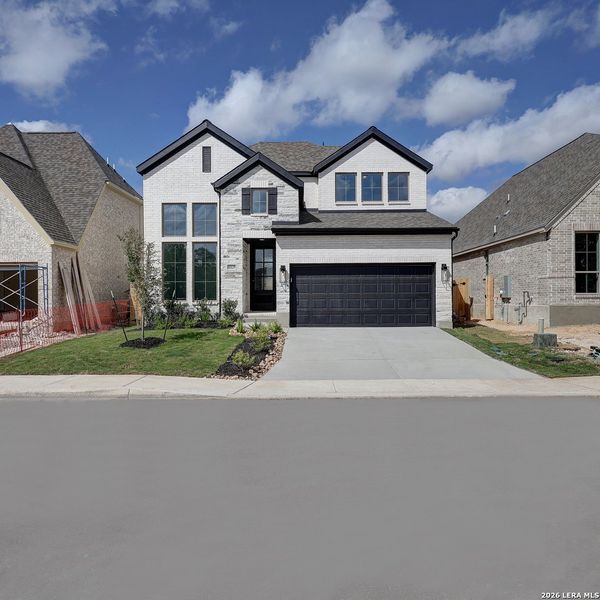 Front exterior of a new home in Kallison Ranch, San Antonio, TX, highlighting curb appeal (Image 1). Front exterior of a new home in Kallison Ranch, San Antonio, TX, highlighting curb appeal (Image 1).