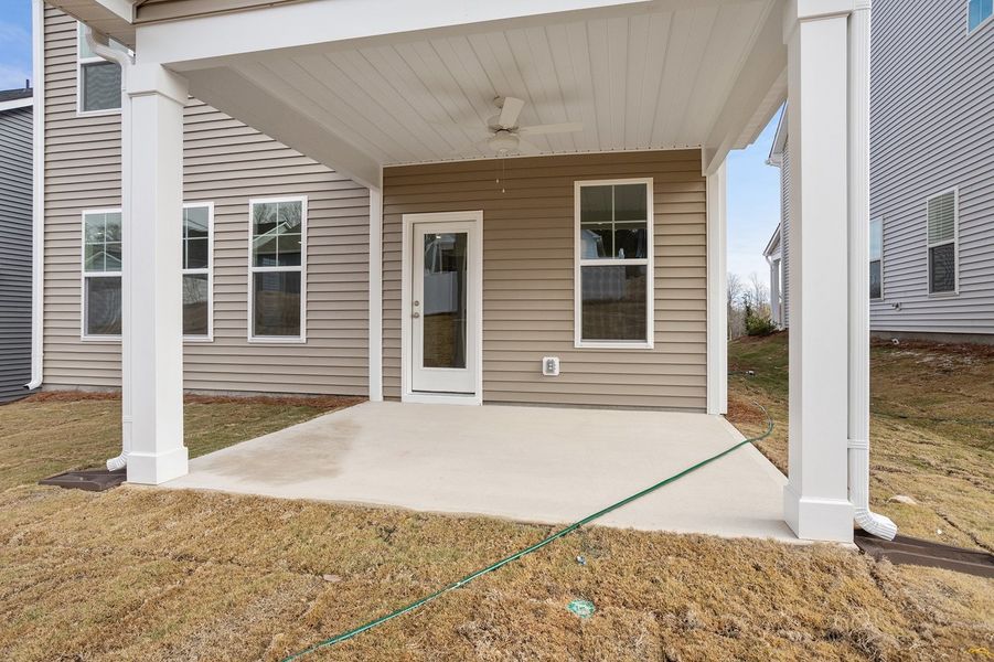 Exterior details and patio area of a home in Renaissance at White Oak, Garner (Image 3).