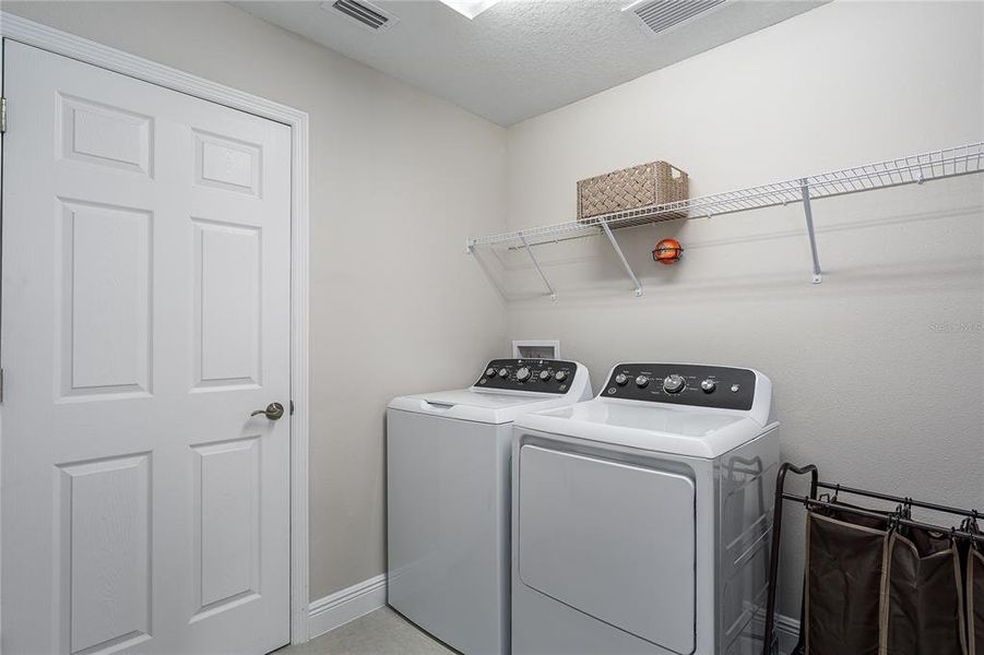 Furnished interior view inside a new home in Crosswind Point, Parrish (Image 6).