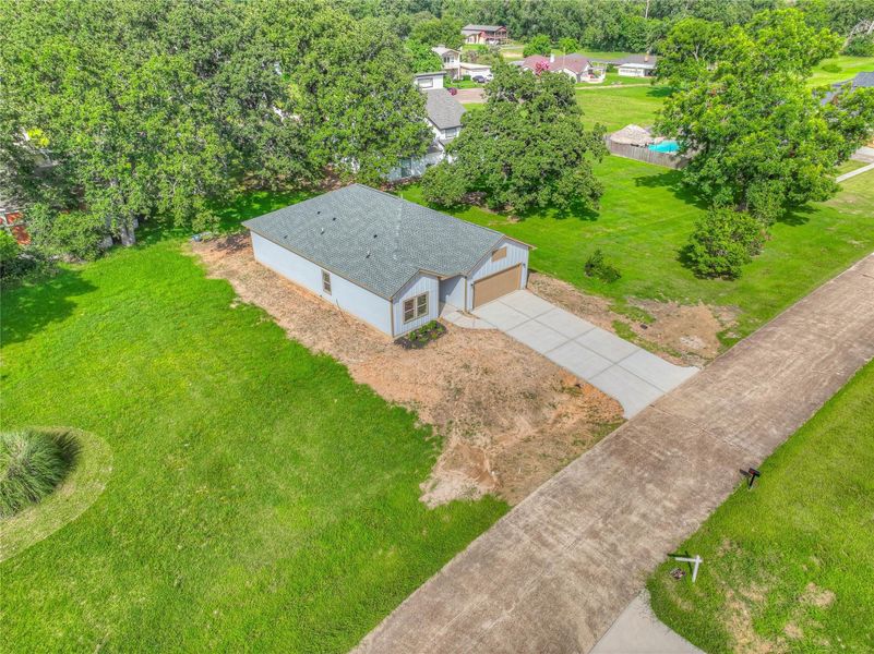 Front exterior of a new home in , Livingston, TX, highlighting curb appeal (Image 14).