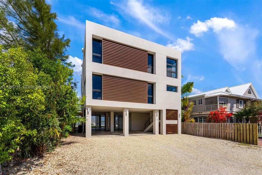 Front exterior of a new home in , Key Largo, FL, highlighting curb appeal (Image 2). Front exterior of a new home in , Key Largo, FL, highlighting curb appeal (Image 2).