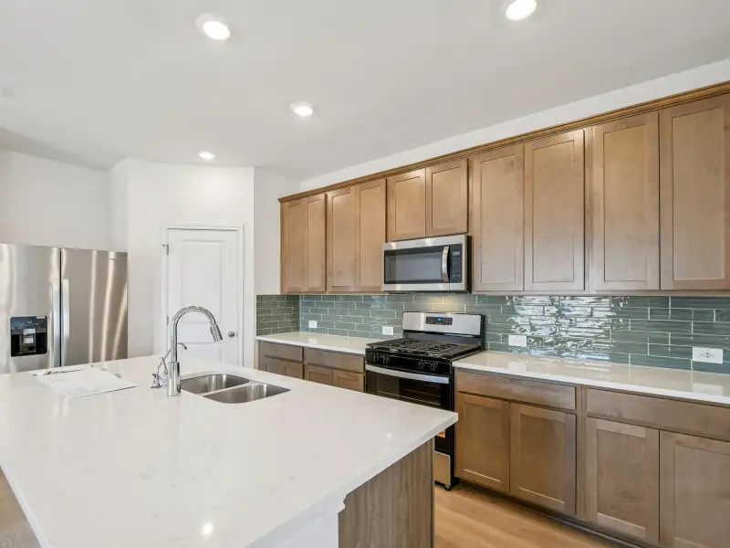 Furnished interior view inside a new home in Riverbend at Double Eagle - Reserve Collection, Cedar Creek (Image 3).