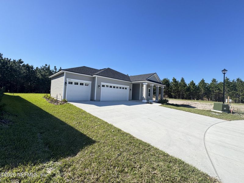 Front exterior of a new home in Hyland Trail, Green Cove Springs, FL, highlighting curb appeal (Image 18).