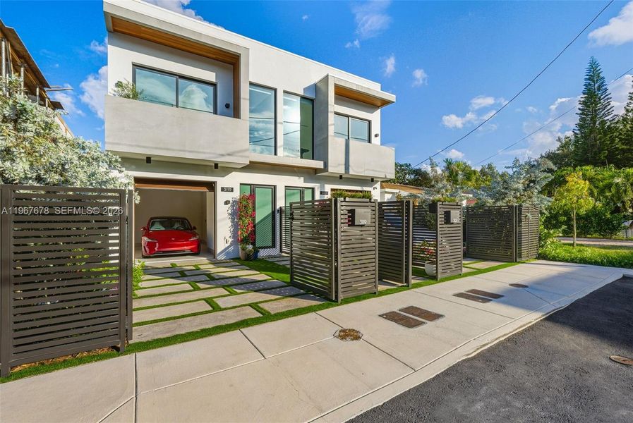 Front exterior of a new home in , Miami, FL, highlighting curb appeal (Image 33).