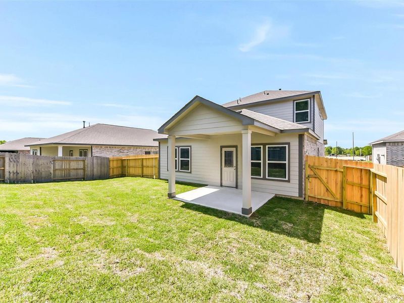 Exterior details and patio area of a home in Windmill Estates, Magnolia (Image 29).